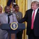 Matthew Charles, who was released from from federal prison after serving 20 years for selling crack cocaine, joins U.S. President Donald Trump for a First Step Act celebration in the East Room of the White House .